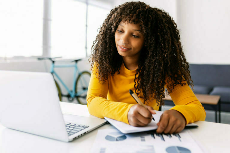 Young businesswoman working on laptop from home office